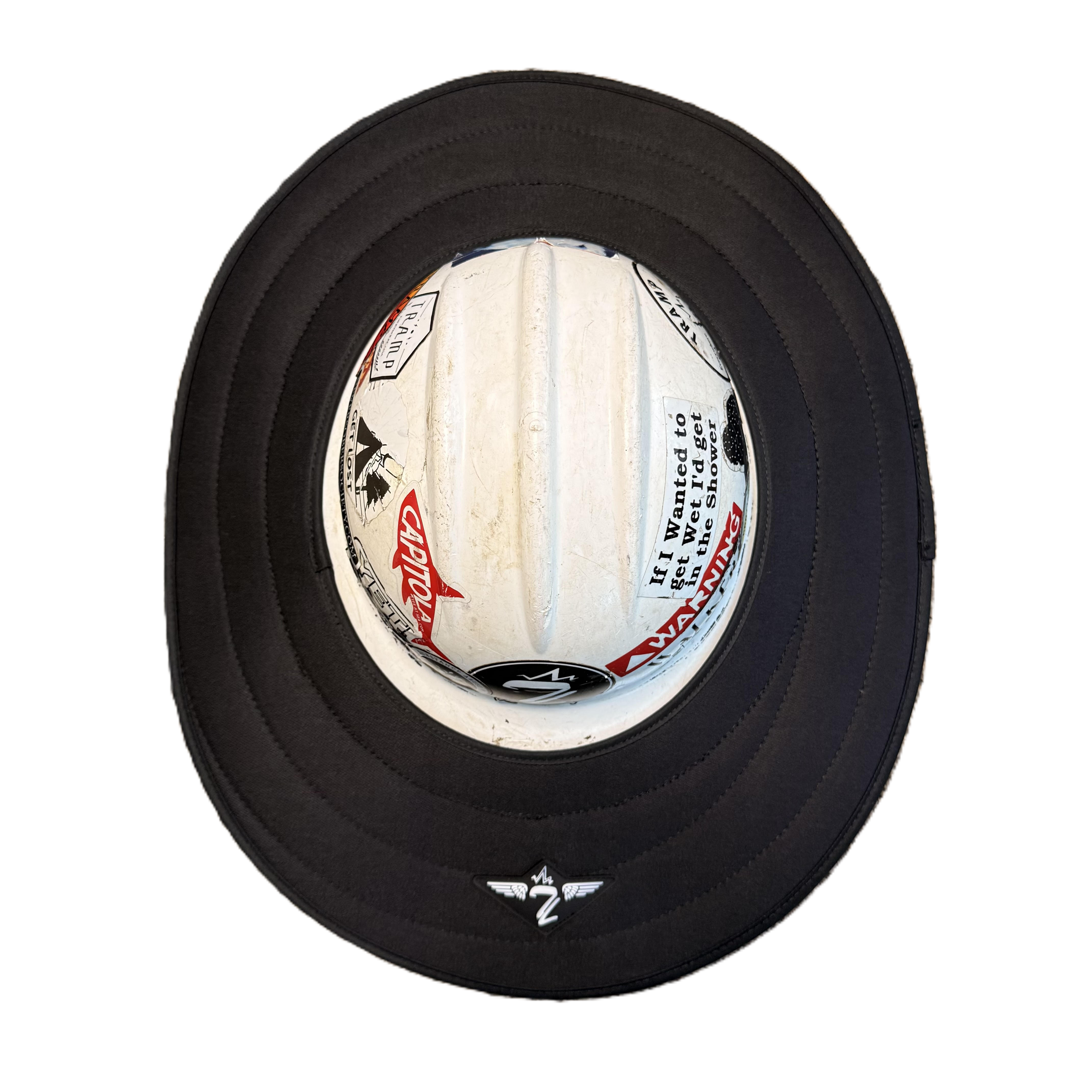 black sunshade from tramp life industries on a white hard hat with stickers