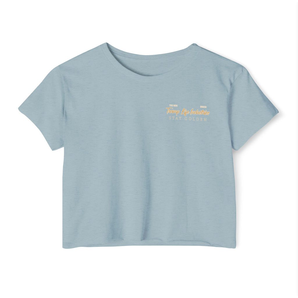 stone wash crop top for blue collar women saying tramp life industries in gold and white writing with the saying stay golden below it