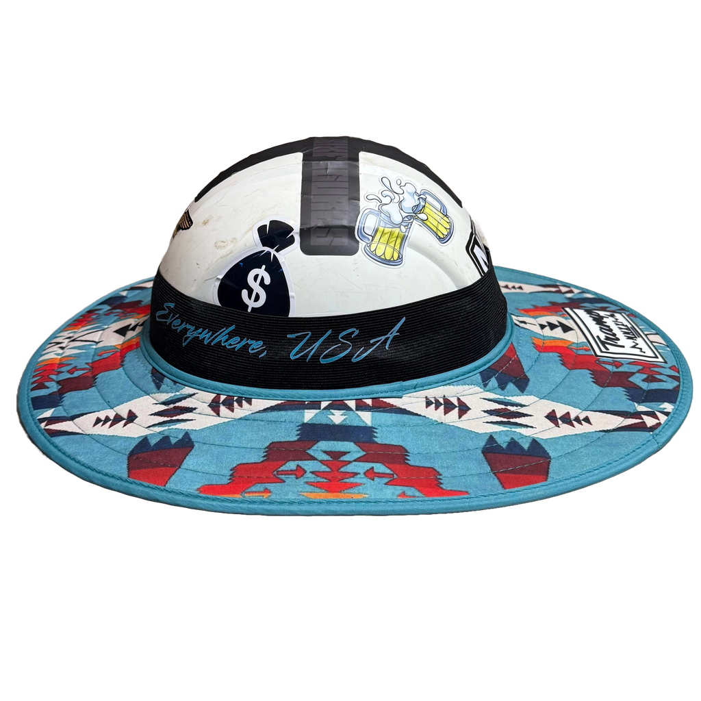 hard hat with a fly shade from tramp life industries. called the turquoise fly shade - it is mostly blue with some red, orange, white, and navy geometric patterns on it
