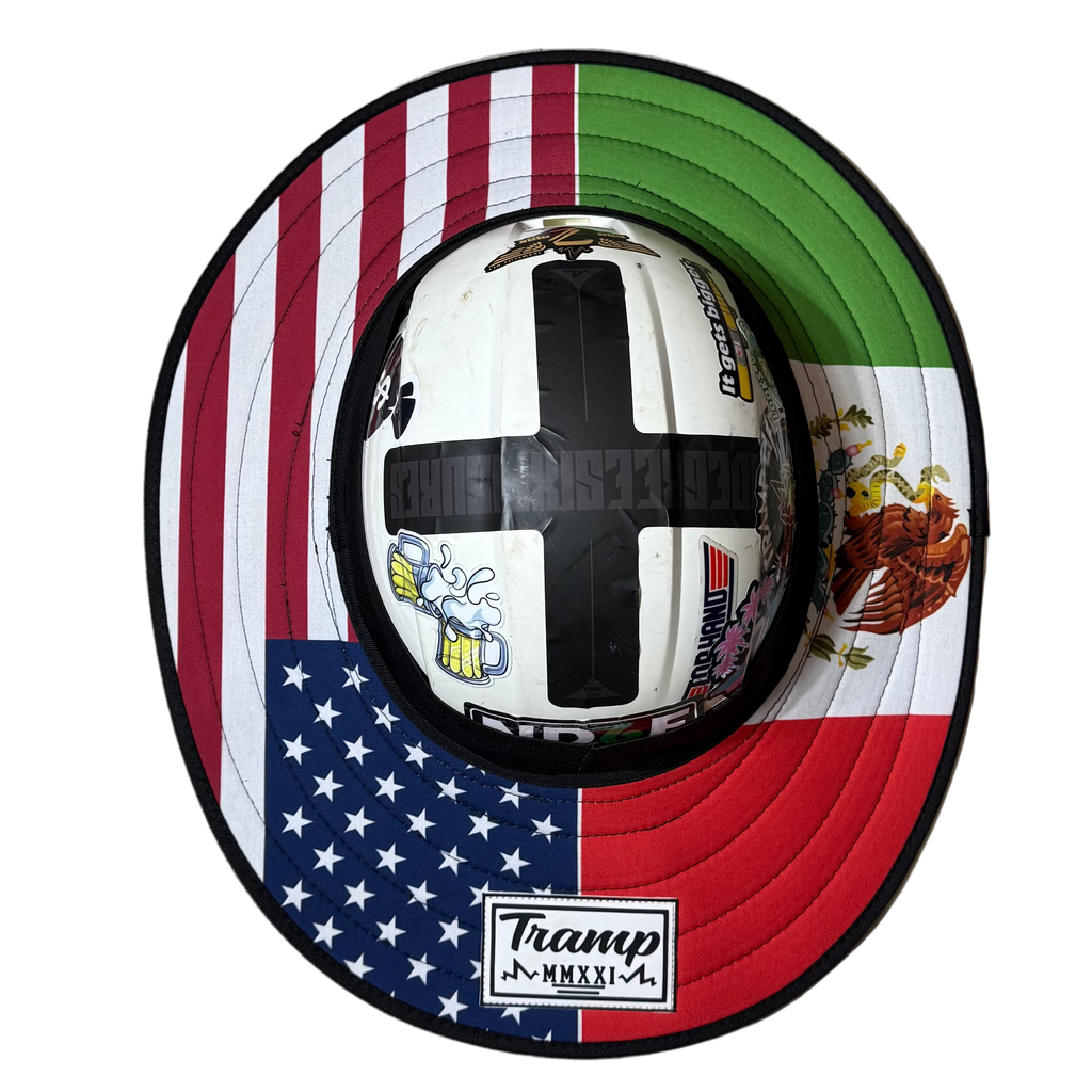 a fly shade made for hard hats with no brim, has half an american flag and half mexican flag. tramp life