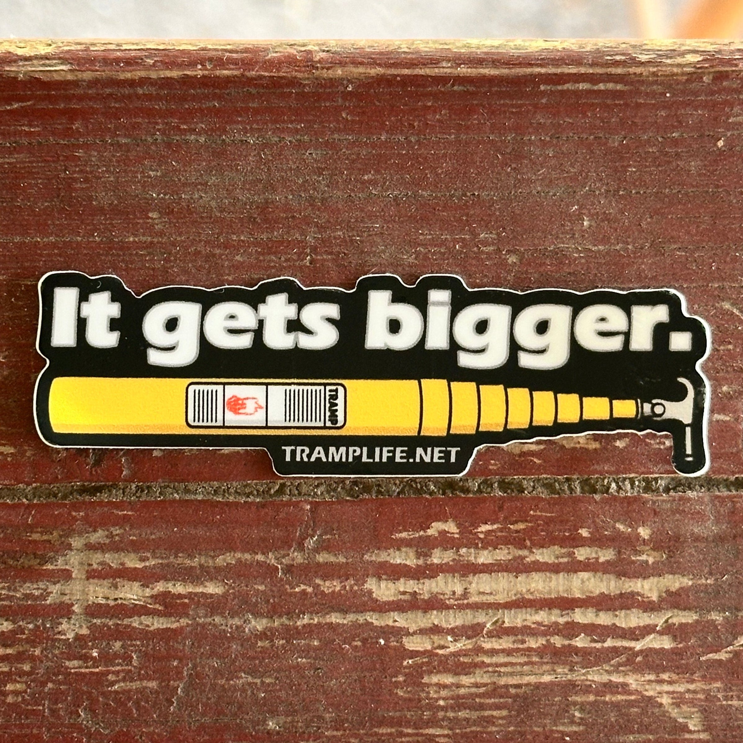 sticker with extendo stick that says it gets bigger