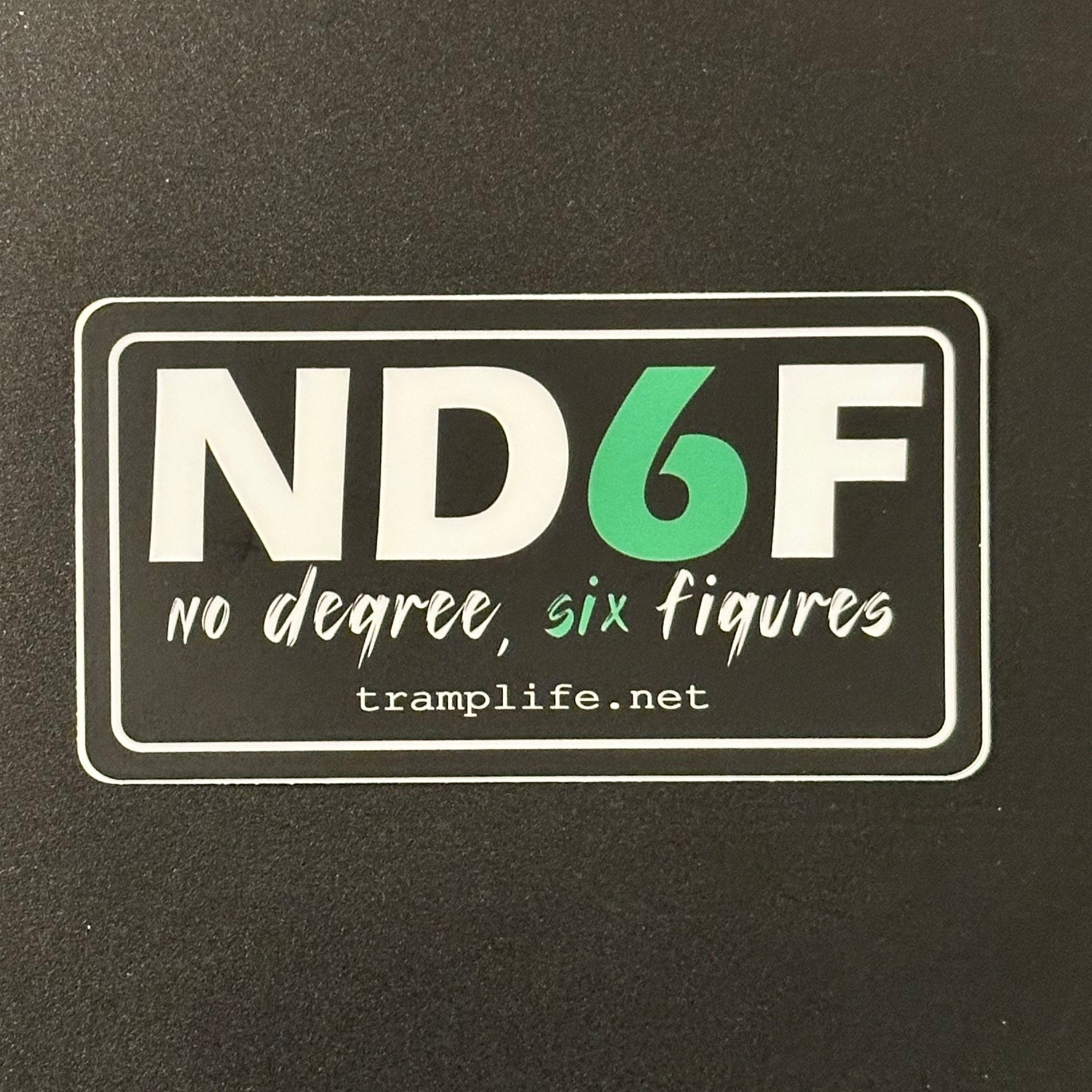 Rectangular sticker with 'ND6F' logo on a dark background