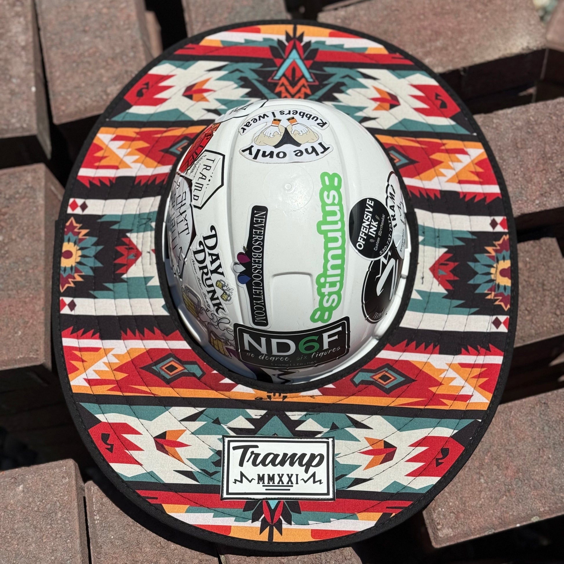 red pendleton sunshade from tramplife on a hard hat on some bricks