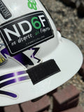 a close up of a hard hat with velcro on it showing where a sunshade attaches to it