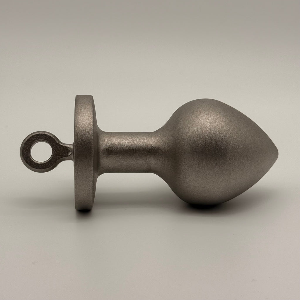 the plug plumb bob from tramp life industries. resembles a butt plug plumb bob. made from stainless steel 304. side view 2