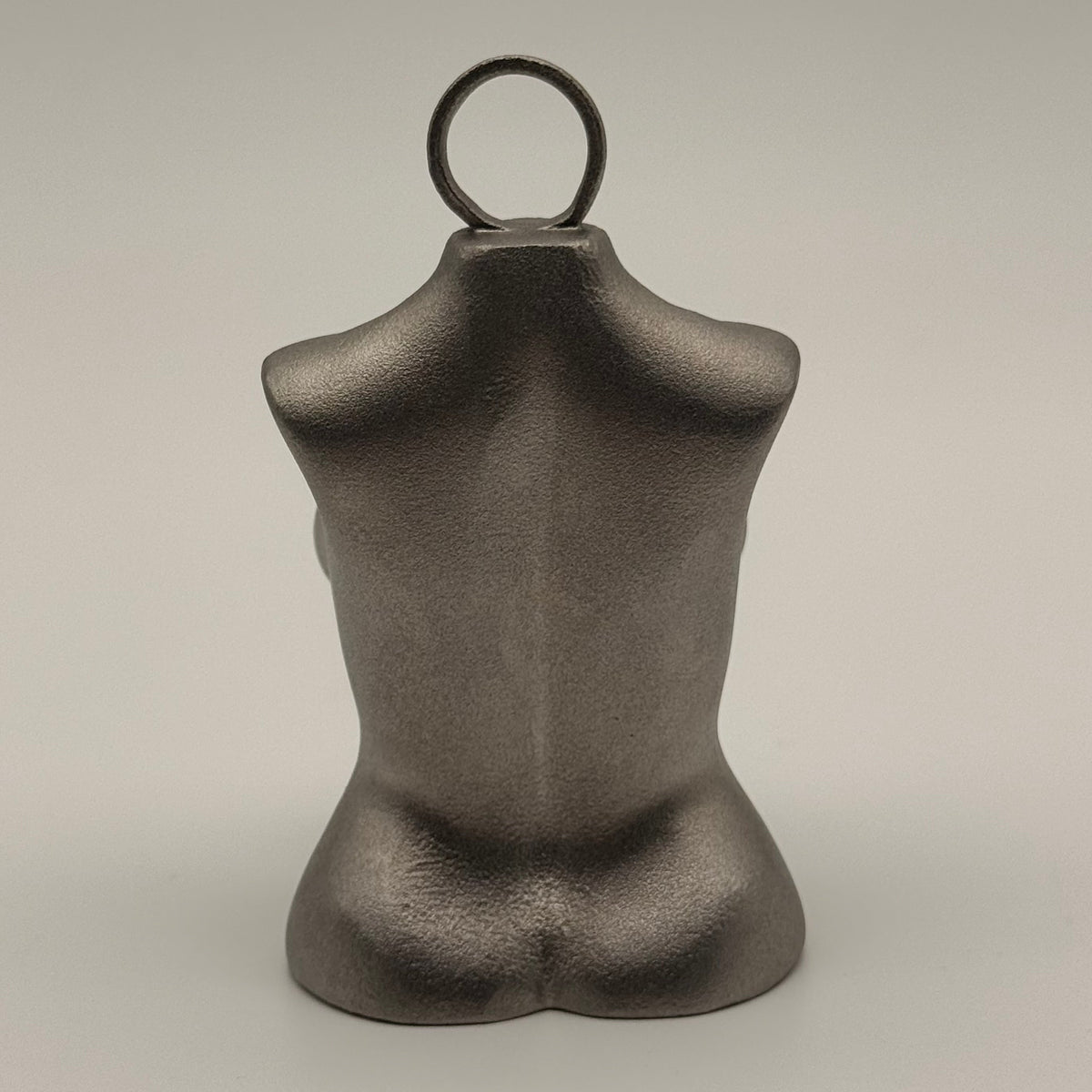 Tramp Life Industries Top Heavy stainless steel plumb bob tool, female torso layout weight gift for linemen and blue-collar workers. back view