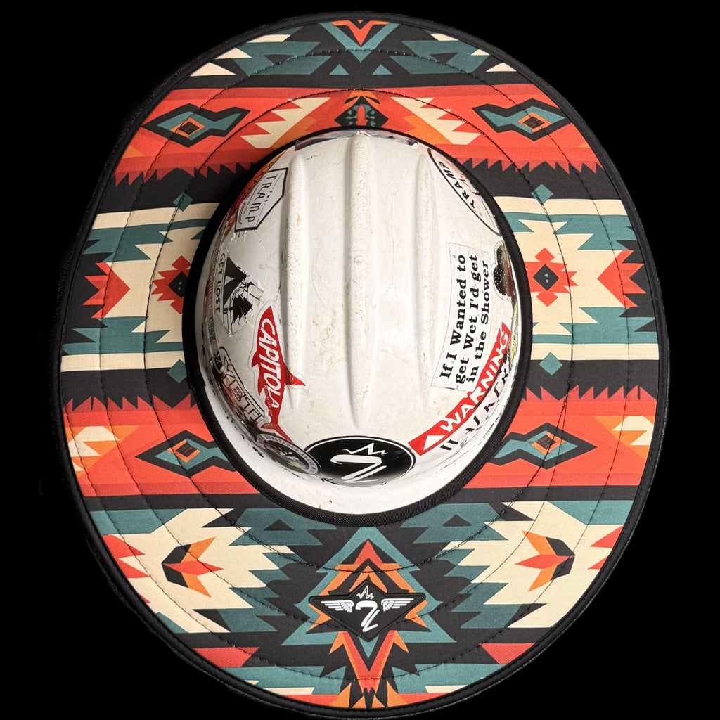 the red pendleton hard hat sunshade from tramp life industries. has a aztec design with blue, red, black, cream, teal and orange.