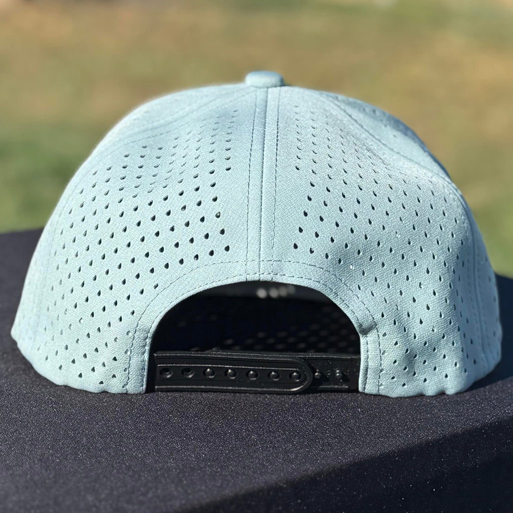 the back of a blue and black embroidered snapback water resistant hat with tramp life, a bone hand, make per diem great again for blue collar workers