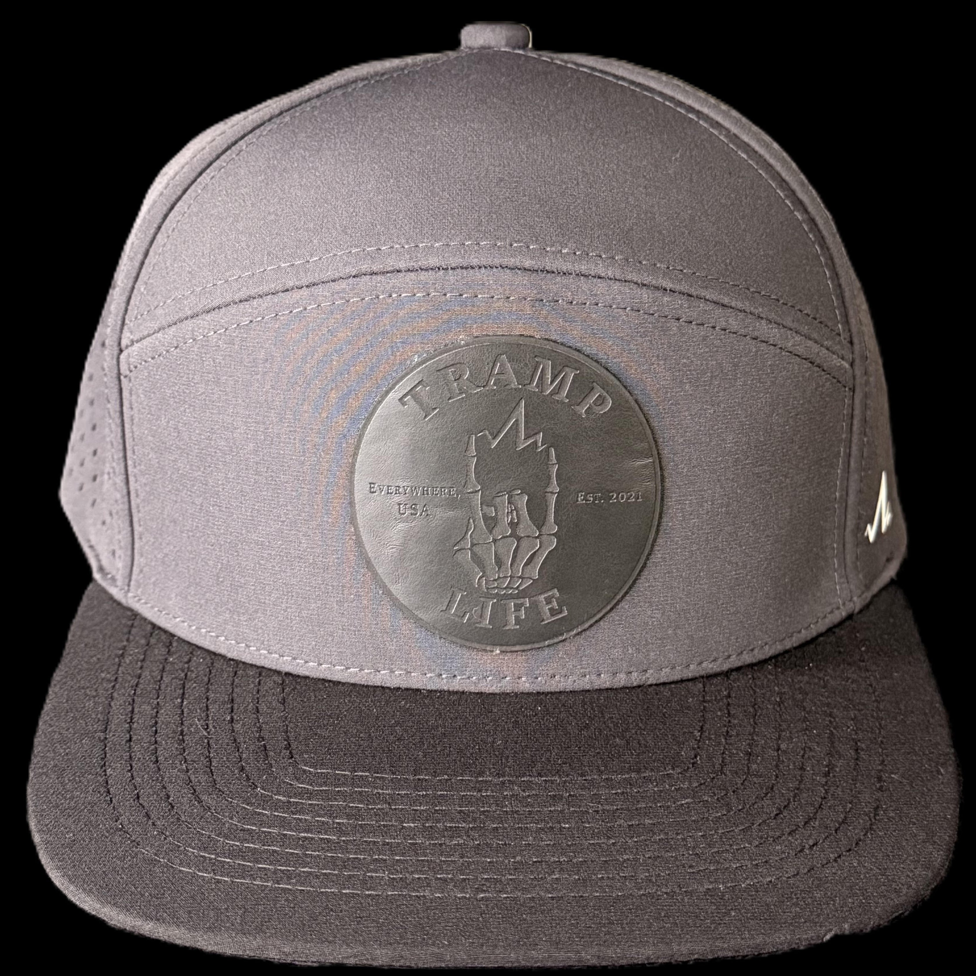 gray hydro rambler from tramp life industries. has a black leather patch on it that says tramp life